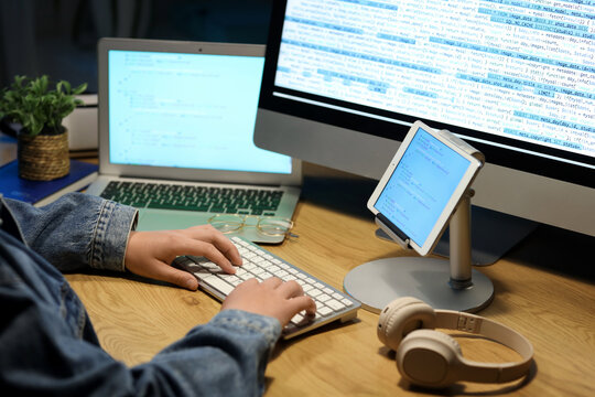 Male programmer working at table in office, closeup
