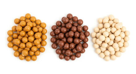 Three piles of chocolate coated nuts, crunchy snacks, sweet treats, isolated on transparent background