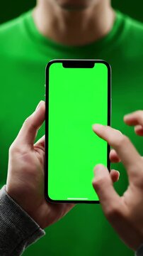 Green Screen 4k man using iphone 12 smartphone viewing on phone press browsing chroma key online typing text reading social media close up hands 24 04 21 st petersburg russia scene 1 with distortion