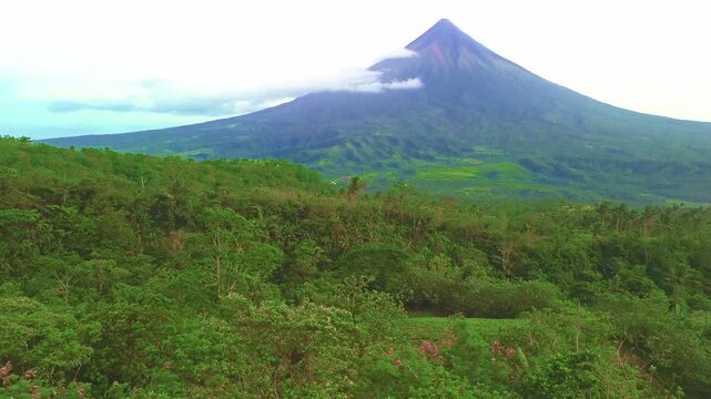 The majestic Mayon Volcano rising above lush tropical jungles in Albay, Philippines
