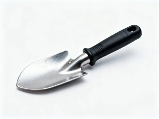 Fototapeta premium A small gardening trowel with a black plastic handle and metallic blade on a white background