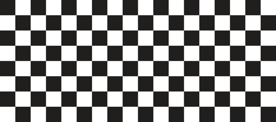 Fototapeta premium Classic black and white checkerboard pattern background. High contrast square grid creates a bold optical texture. Ideal for racing themes, retro design, and graphic backdrops.