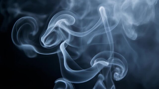 Abstract swirling blue smoke patterns on black background for creative and atmospheric designs