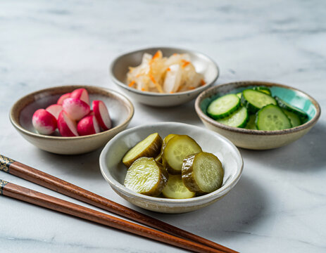 Japanese pickled vegetables in small ceramic bowls