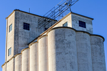 Concrete silos and structural infrastructure at abandoned flour mill, representing historic agricultural processing facility and industrial storage architecture © Eduardo Barraza