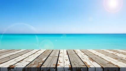 Fototapeta premium Serene ocean view from a weathered wooden dock on a sunny day