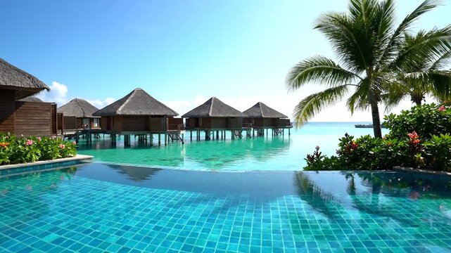 Luxurious villas with private pools and palm trees overlooking the serene ocean view from a tranquil resort