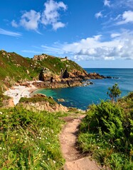 A serene coastal path overlooking a tranquil turquoise sea