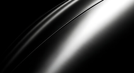 Close up of a sleek curved metallic surface reflecting light with a dramatic black background