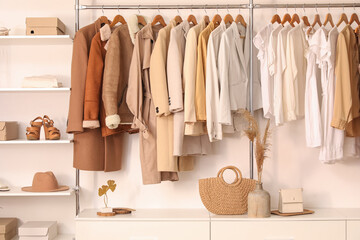 Stylish clothes with shoes and accessories in boutique