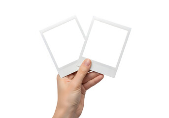 Hand Holding Two Blank Polaroid Instant Photo Frames Mockup Isolated on White or Transparent Background