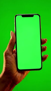 Green Screen female hand holding a smartphone with in home chroma key phone video scene 2 distortion, overlay, glitch, static noise, scan lines on black background, 4k animated loop