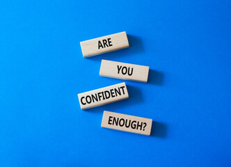 Confidence symbol. Concept words Are you confident enough wooden blocks. Beautiful bright blue background. Business and Are you confident enough concept. Copy space.