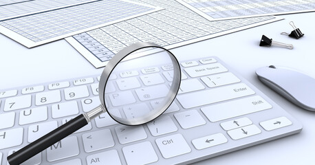 虫メガネとキーボードとビジネス書類