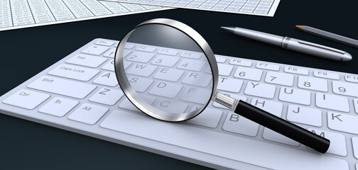 虫メガネとキーボードとビジネス書類