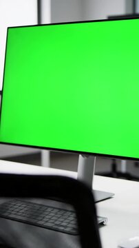 Empty Office Tech with close up of monitor in green screen employee working at computer sitting desk view from back distortion, overlay, glitch, static noise, scan lines on black background, 4k
