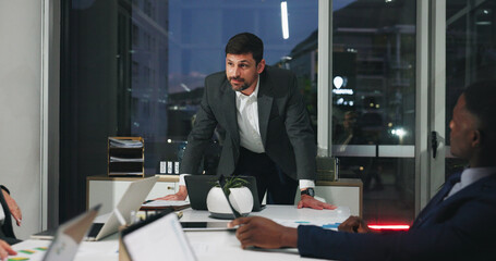 Night, meeting and man in office with team, business people and brainstorming ideas at digital...