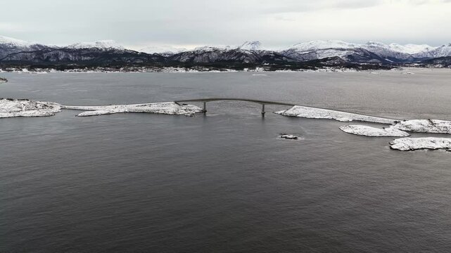 Aerial view of the snow covered landscape around the famous Atlantic Ocean Road connecting the municipalities Averoey and Hustad on the northwest coast of Norway.