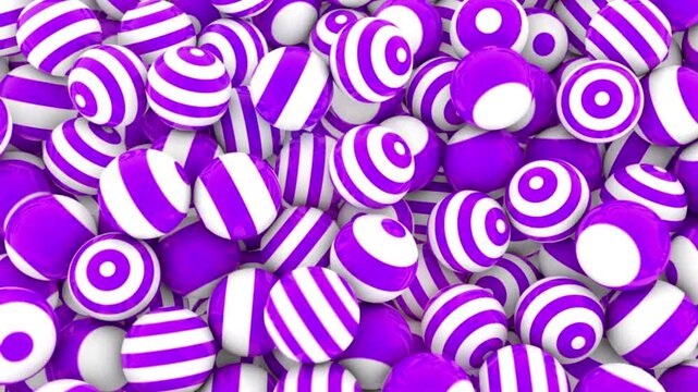 Vibrant purple and white striped candy balls in a sweet treat pile