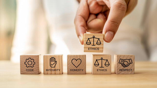 Ethical principles in action. An image of wooden blocks, each representing a different ethical principle such as code, integrity, honesty, ethics, and respect.