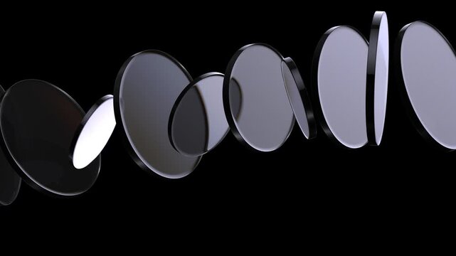 Loop 3d animation. Translucent glass blocks spin and rotate on black background, round lenses.