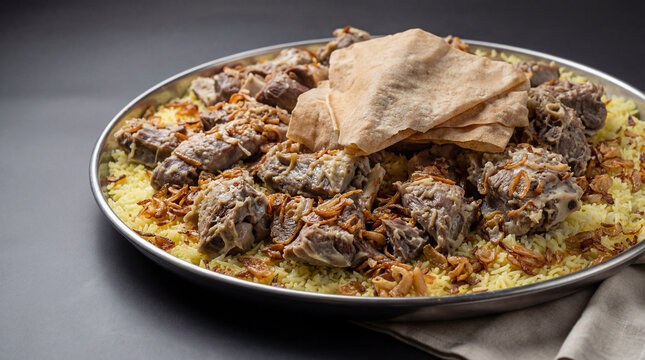 Traditional lamb Mansaf Served with Rice and Jameed