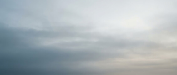 Overcast sky with soft, diffused light and muted grey clouds, creating a calm, atmospheric, and neutral background