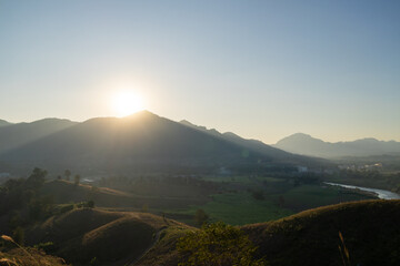 Obraz premium Sunrise over rolling hills nature landscape scenic viewpoint tranquil environment