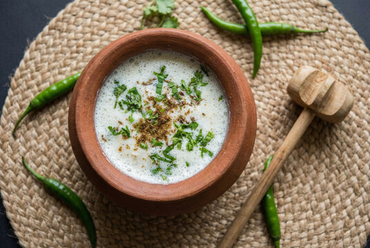 Traditional Indian spiced buttermilk or Chaas in rustic clay pot