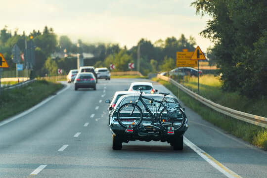 Oldtimer vehicle with bike on trunk rack