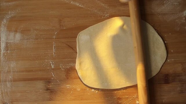 Female baker preparing dough for homemade pastry