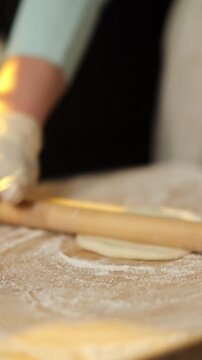 Female baker preparing dough for homemade pastry