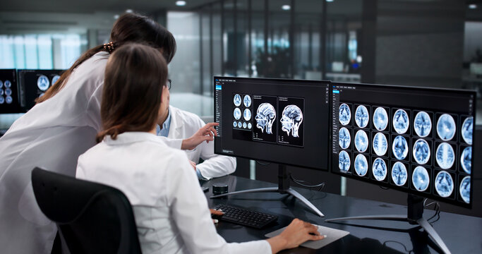Skilled Neurologists Carefully Analyzing Brain Scans