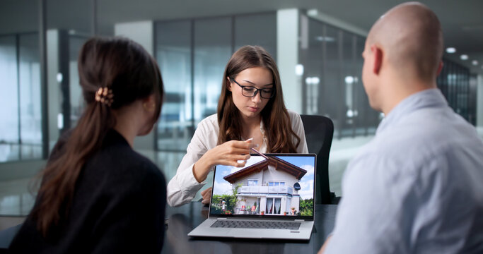 First-Time Homebuyers Meet With Real Estate Agent