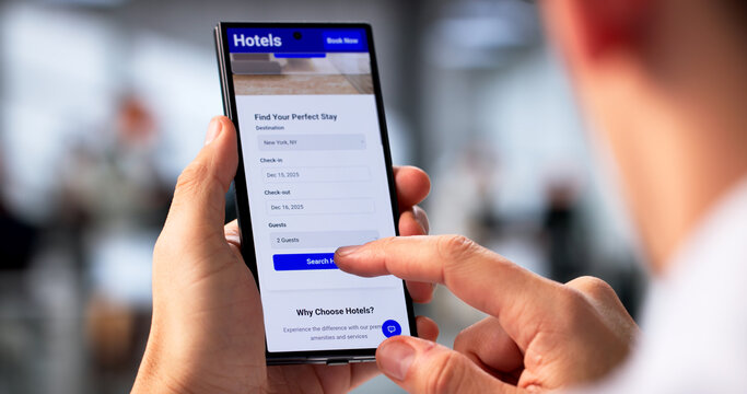 Young Hispanic Man Browsing Smartphone For Hotel Deals Online