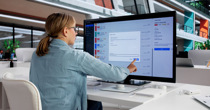 Female IT Specialist Monitoring Software Support Tickets