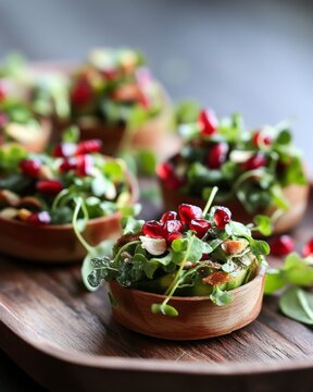 Healthy salad with microgreens and pomegranate in bowls, styled with daylight and wooden texture. Concept: freshness, natural food, minimalism.