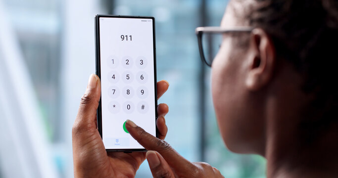 African American Woman Dialing Emergency 911 Number On Smartphone