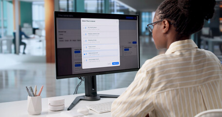 Black Female Computer Specialist Enhancing Workflow