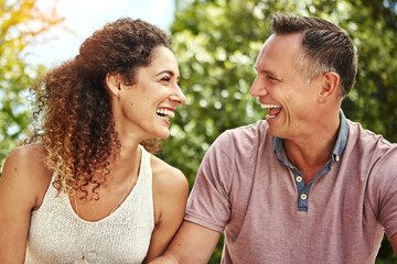 Fototapeta premium Laughing, travel and love with couple outdoor for anniversary getaway, explore and summer vacation. Romantic holiday, bonding and connection with man and woman in nature for funny joke and support