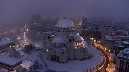 Fototapeta premium Drone view of Saint Sava, orthodox church in Belgrade, Serbia in winter snowing time.