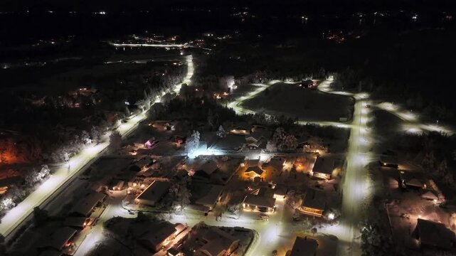 Aerial nighttime view of the suburban area of Storbakken on the island of Freioeya in Kristiansund municipality, Norway.