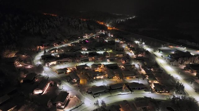 Aerial nighttime view of the suburban area of Storbakken on the island of Freioeya in Kristiansund municipality, Norway.