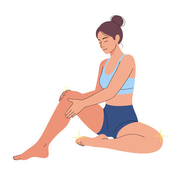Young woman stretching and massaging her leg on a white background  