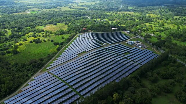 High-altitude aerial showing the solar energy facility within the wider land context of Palauig, Zambales.