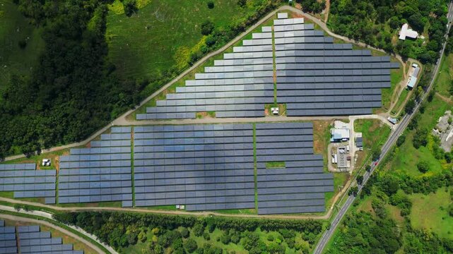 Oblique aerial angle highlighting depth and alignment of solar panels in Palauig, Zambales.