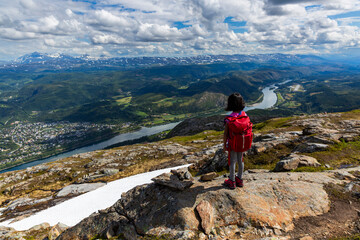 Naklejka premium Child Enjoying River View While Hiking in Helgeland