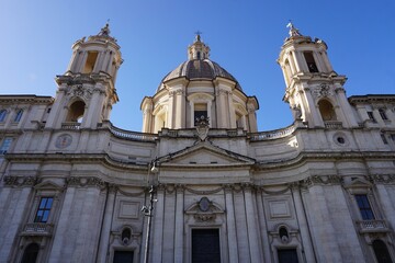 Obraz premium Front entrance and dome of Sant'Agnese in Agone, a baroque Catholic church on Piazza Navona, Rome, Italy