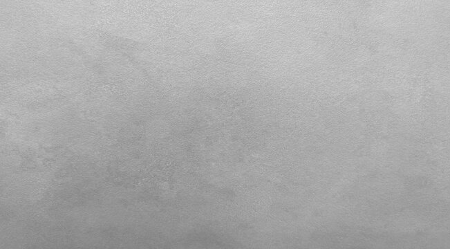 Parete grigia con texture materica e dettagli superficiali