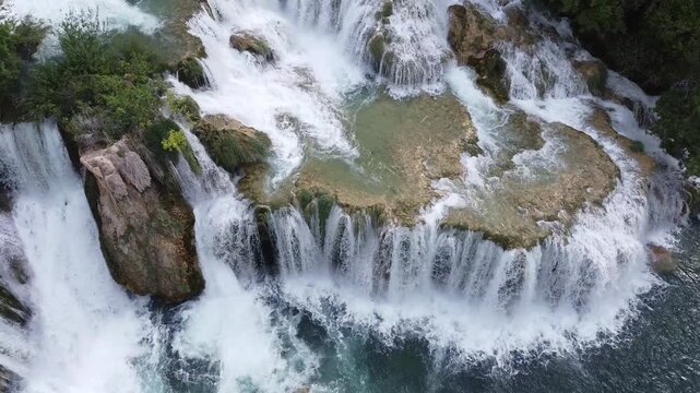 Close up aerial views of a powerful waterfall with focus on water flow in Krka Croatia